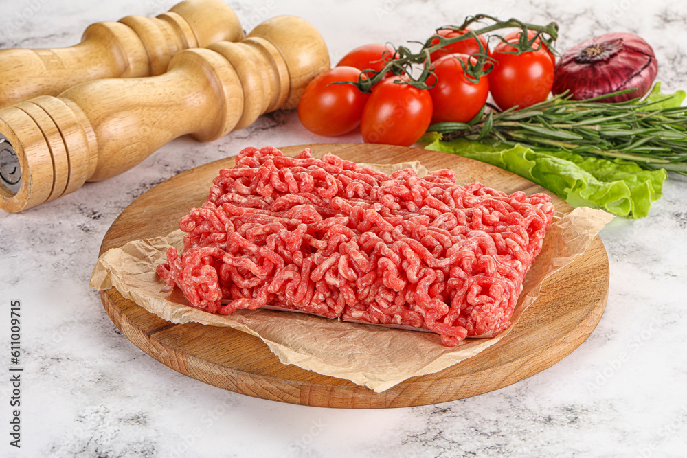 Raw minced beef meat on cutting board Raw minced beef meat on cutting board