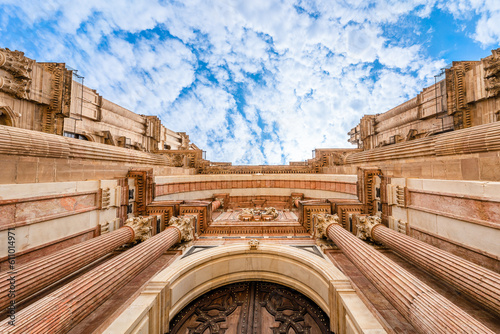Wide angle upwards view of the facade of the Cathedral of Malaga; Malaga Cathedral in Malaga, Andalusia, Spain