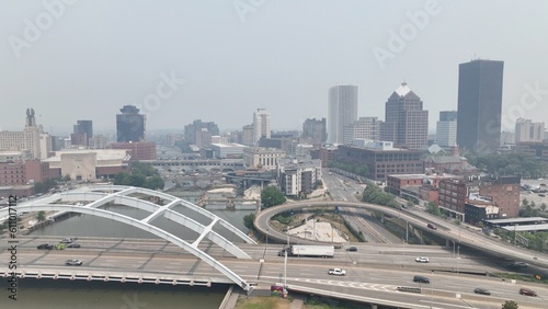 Rochester NY skyline with Canada forest fire smoke over office building and streets downtown bringing poor air quality caused by climate change in America and Canada
