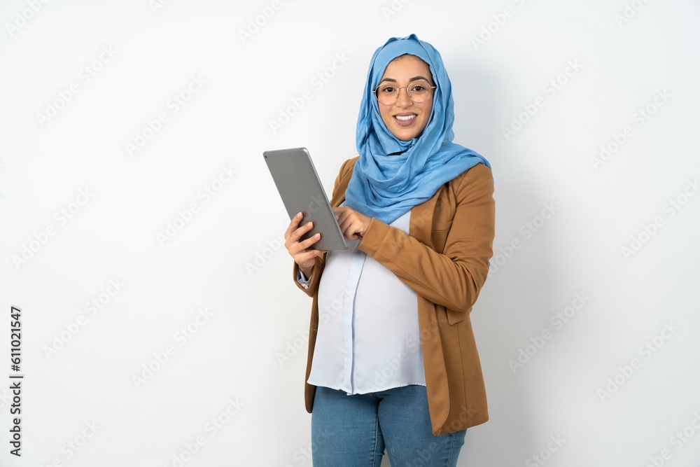 Photo of happy cheerful smart woman hold tablet browsing internet Photo of happy cheerful smart woman hold tablet browsing internet