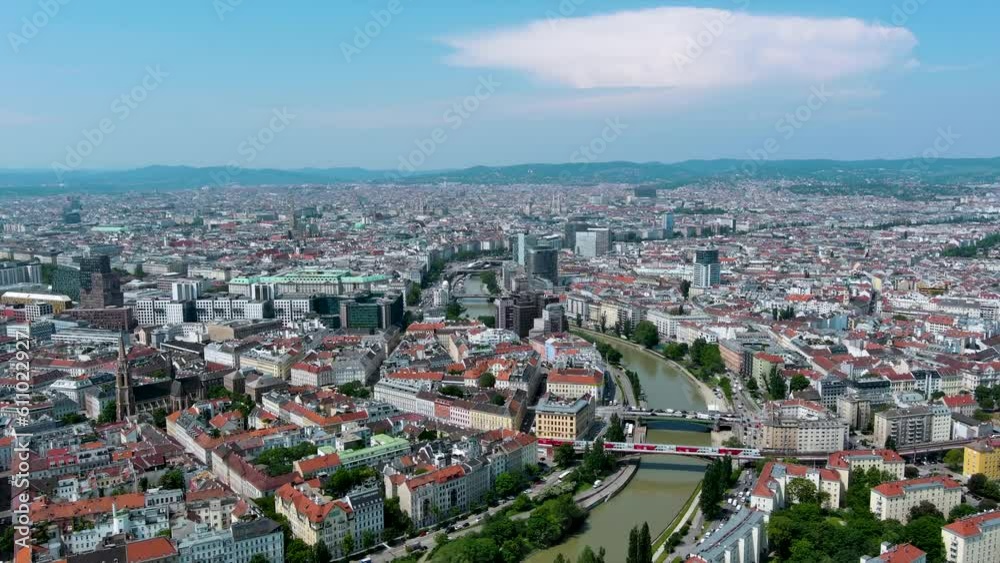 Beautiful aerial panoramic view of Vienna City in summer on a sunny day. Austria’s capital, lies in the country’s east on the Danube River in Central Europe ft. above rooftop view of town center 4K Beautiful aerial panoramic view of Vienna City in summer on a sunny day. Austria’s capital, lies in the country’s east on the Danube River in Central Europe ft. above rooftop view of town center 4K