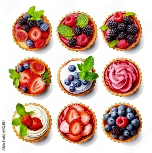Tarts with strawberries, currant and whipped cream decorated with mint leaves