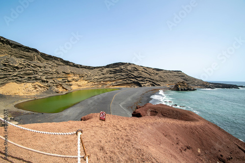 the famous green lake found behind the beach at El Golfo in Lanzarote.  photo