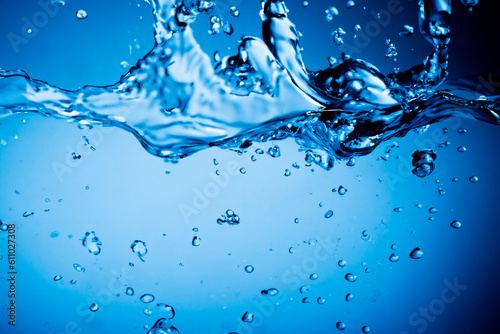 Blue water splash. Splash of water flow with bubble. Close up water. Fresh blue natural drink water. Ai generated image.