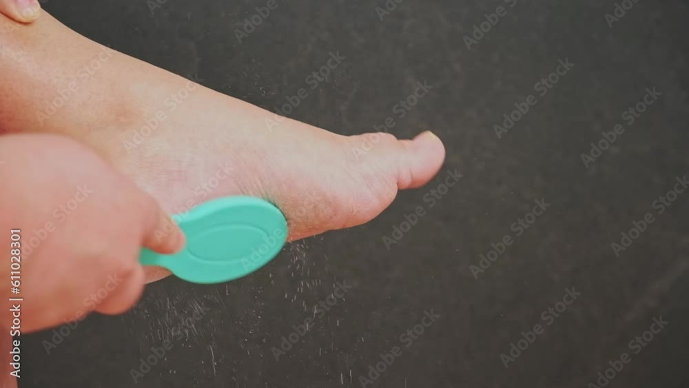 A metallic foot file for pedicure. One side is rough. It is designed to