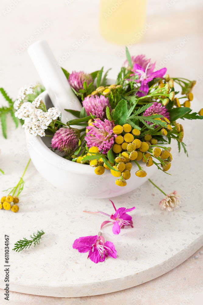 medical flowers herbs in mortar. clover milfoil tansy rosebay. healthy natural lifestyle