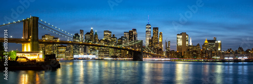 New York City skyline of Manhattan panorama with Brooklyn Bridge and World Trade Center skyscraper at twilight in the United States