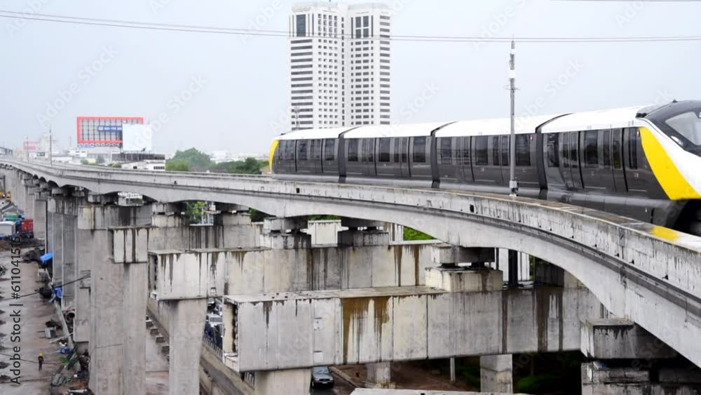 Bangkok,Thailand - 6June, 2023: Thai electric monorail train yellow line in Bangkok Bangkok,Thailand - 6June, 2023: Thai electric monorail train yellow line in Bangkok