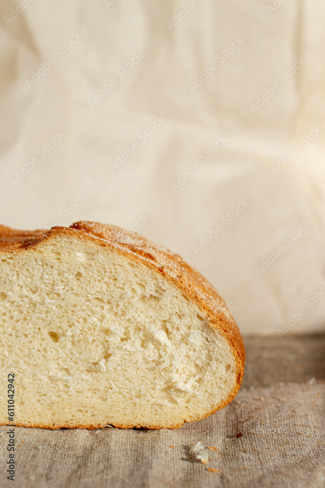 fresh white bread in a cut, on a light background