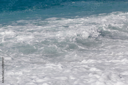 view on foamy waves on beach in Nice