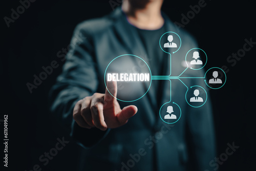 The manager delegates work to another person in the team, exemplifying the managerial concept of delegation and the effective distribution of tasks.