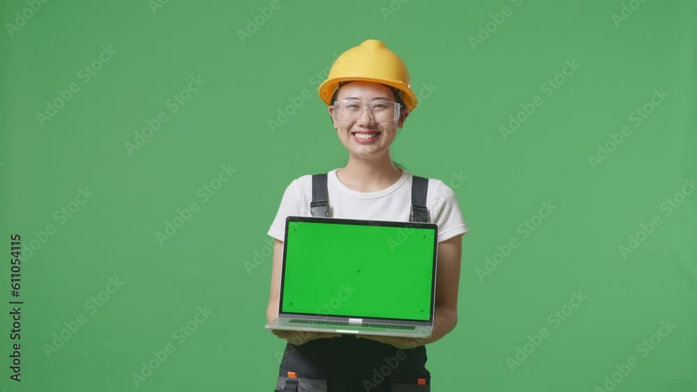 Asian Woman Worker Wearing Goggles And Safety Helmet Smiling And Showing Green Screen Laptop To The Camera While Standing In The Green Screen Background Studio
Asian Woman Worker Wearing Goggles And Safety Helmet Smiling And Showing Green Screen Laptop To The Camera While Standing In The Green Screen Background Studio