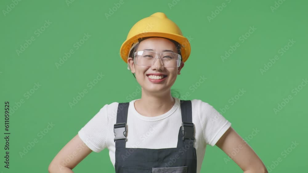Close Up Of Asian Woman Worker Wearing Goggles And Safety Helmet Standing With Arms Akimbo Looking At Camera And Smiling In The Green Screen Background Studio
Close Up Of Asian Woman Worker Wearing Goggles And Safety Helmet Standing With Arms Akimbo Looking At Camera And Smiling In The Green Screen Background Studio