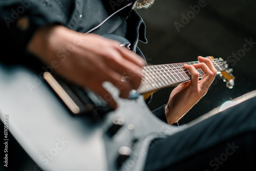 Canvas Print rock performer with electric guitar in recording studio recording playing own tr