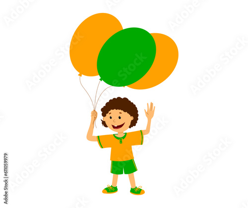 Happy boy with balloons cheerfully waves his hand. A child in orange and green clothes. Children s holiday.