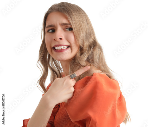 Confused woman pointing at ...