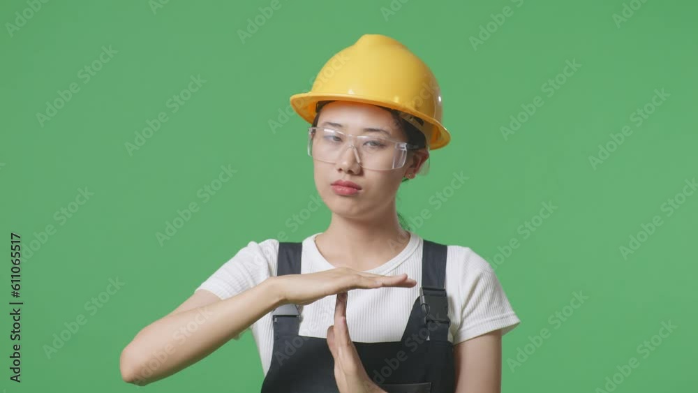 Close Up Of Asian Woman Worker Wearing Goggles And Safety Helmet Looking At Camera And Showing Time Out Hands Gesture While Standing In The Green Screen Background Studio
Close Up Of Asian Woman Worker Wearing Goggles And Safety Helmet Looking At Camera And Showing Time Out Hands Gesture While Standing In The Green Screen Background Studio