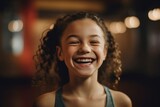 Medium shot portrait photography of a satisfied kid female laughing against a peaceful yoga studio background. With generative AI technology