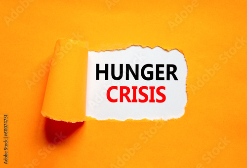 Hunger crisis symbol. Concept words Hunger crisis on beautiful white paper on a beautiful orange background. Business, support and Hunger crisis concept. Copy space.