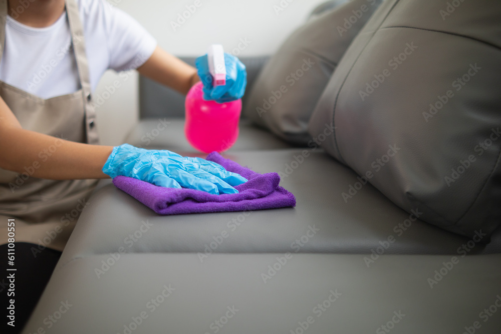 Cleaning staff is wiping cloth with cleaner and disinfectant on the