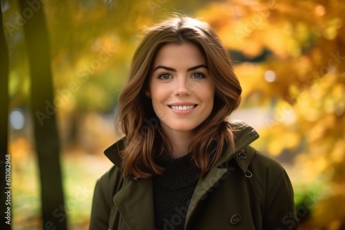 Lifestyle portrait photography of a glad girl in her 30s wearing a versatile overcoat against an autumn foliage background. With generative AI technology