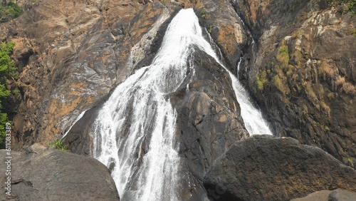 High waterfall cascade in mountain big rocks