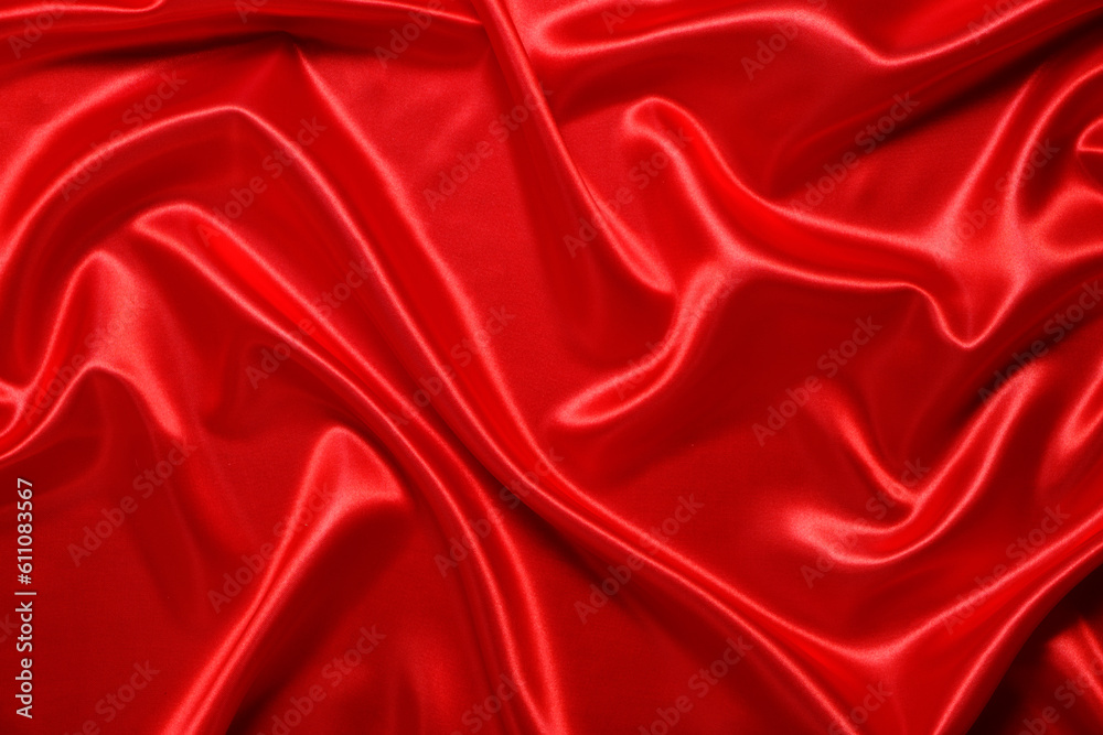 Obraz premium Abstract background made of red silk wavy fabric.