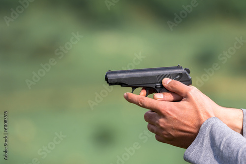 Man holding a gun in his hand