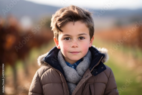 Headshot portrait photography of a glad kid male wearing a cozy winter coat against a vineyard background. With generative AI technology
