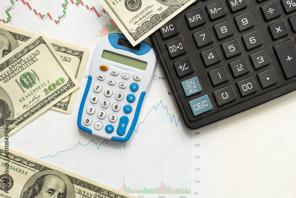 Business concept with graphs. A bundle of money on a graph. Business concept with graphs. A bundle of money on a graph.