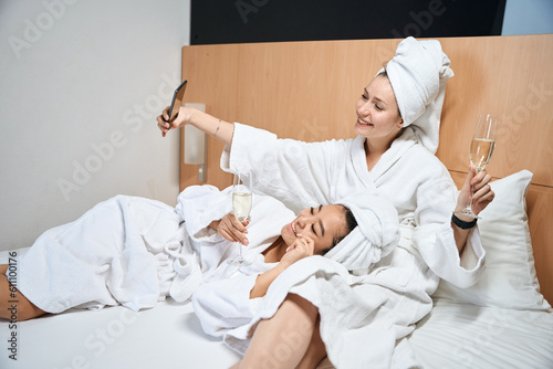 Selfie of two smiling women in a hotel room