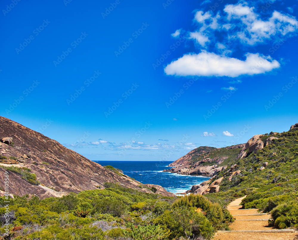 The granite coast with turquoise water at Cape Le Grand National Park, Western Australia. In the distance islands of the Recherche Archipelago

