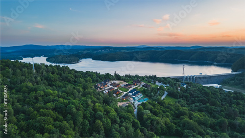 Panoramic view from the drone during sunset  on the Solina Lake over the Solina water dam  in the Polish Bieszczady Mountains  Poland