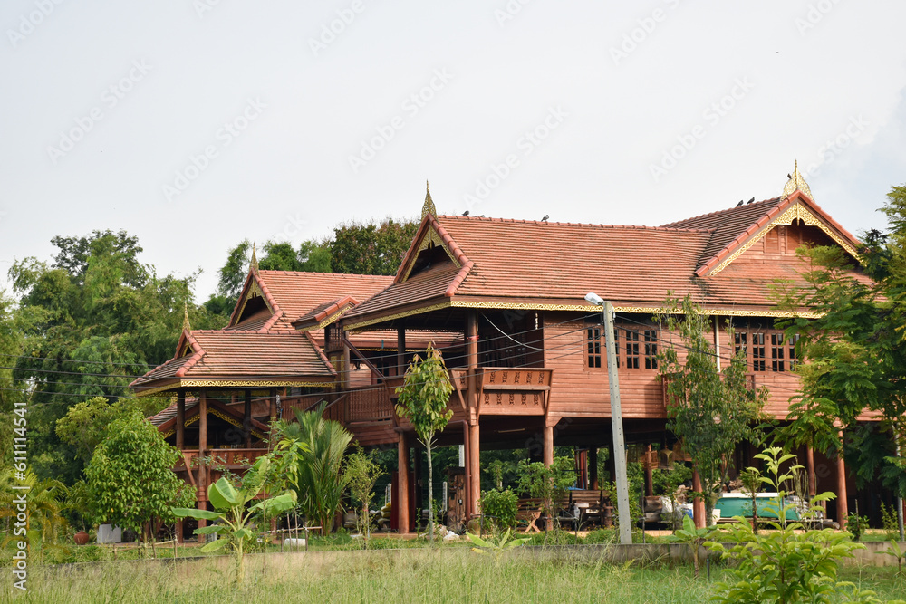 Exterior building traditional Thailand style with green garden, wooden house beautiful detail architecture Exterior building traditional Thailand style with green garden, wooden house beautiful detail architecture