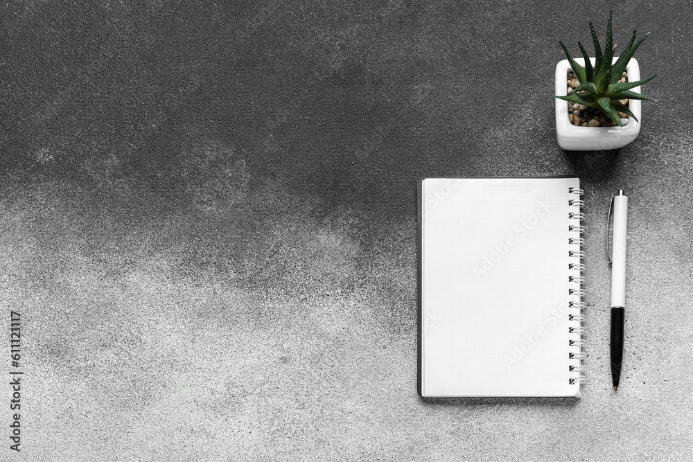 Notebook, pen with flowerpot on black and white background. Update concept Notebook, pen with flowerpot on black and white background. Update concept