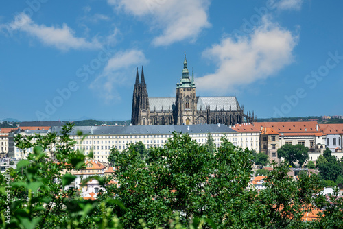 Prague Castle with the Saint s Cathedral welcomes you in the center of the city with trees in the foreground. Prague  Czech Republic.