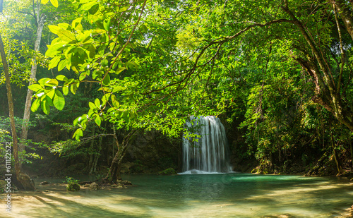 Erawan Waterfall Jungle landscape with flowing turquoise waters of Erawan Waterfall at Tropical Rainforest Kanchanaburi National Park