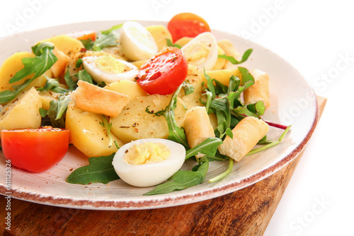 Plate of tasty potato salad isolated on white, closeup