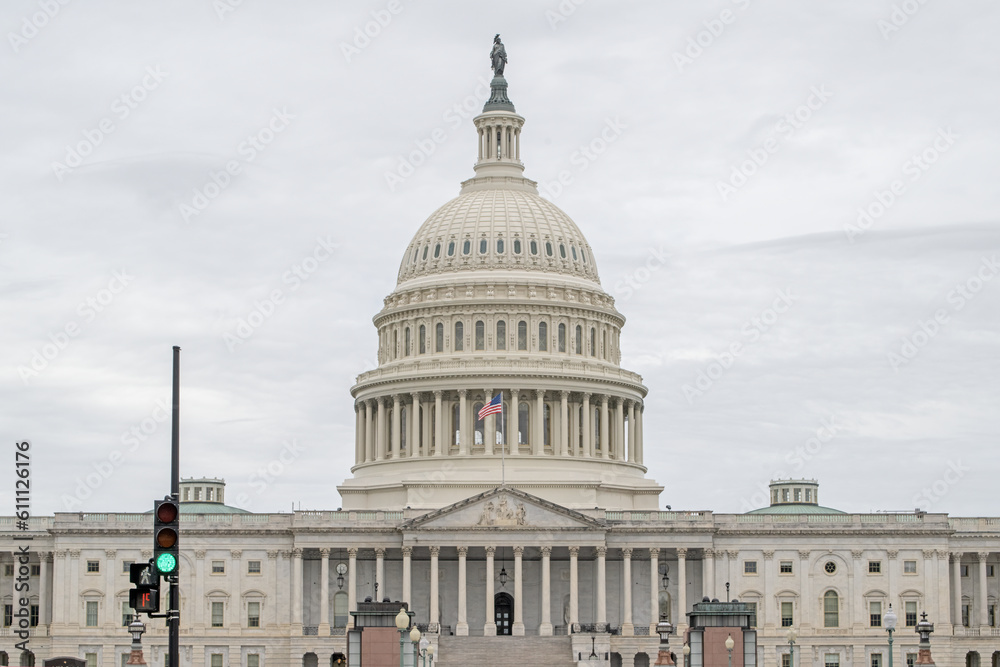 U.S. Capitol, Washington, DC with a green traffic light in front. U.S. Capitol, Washington, DC with a green traffic light in front.