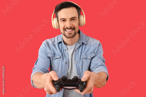 Smiling man wearing headpho...