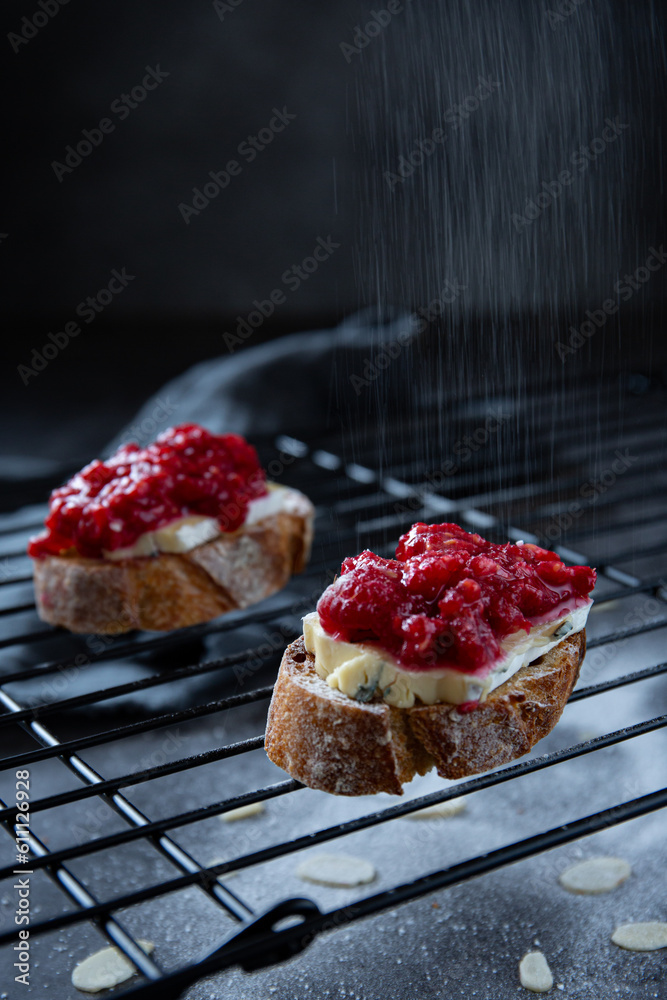Sandwiches with cheese and raspberry jam on dark background ` Sandwiches with cheese and raspberry jam on dark background `