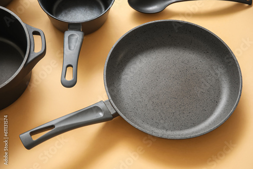 Frying pan on beige background