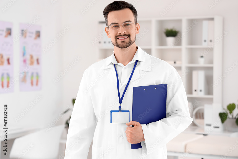 Male physiotherapist with clipboard in rehabilitation center Male physiotherapist with clipboard in rehabilitation center