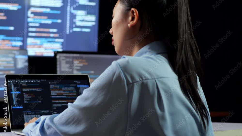 Close Up Back View Of Asian Female Programmer Leaning On Table While Writing Code By A Laptop Using Multiple Monitors Showing Database On Terminal Window Desktops In The Office
Close Up Back View Of Asian Female Programmer Leaning On Table While Writing Code By A Laptop Using Multiple Monitors Showing Database On Terminal Window Desktops In The Office
