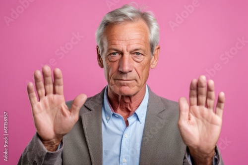 Medium shot portrait photography of a glad mature man making a sorry gesture with hands together against a pastel or soft colors background. With generative AI technology