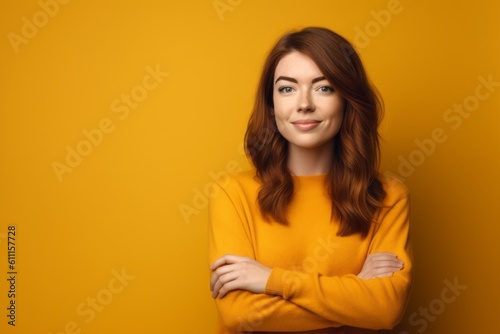 Headshot portrait photography of a satisfied girl in her 20s crossing the arms against a mustard yellow background. With generative AI technology © Markus Schröder