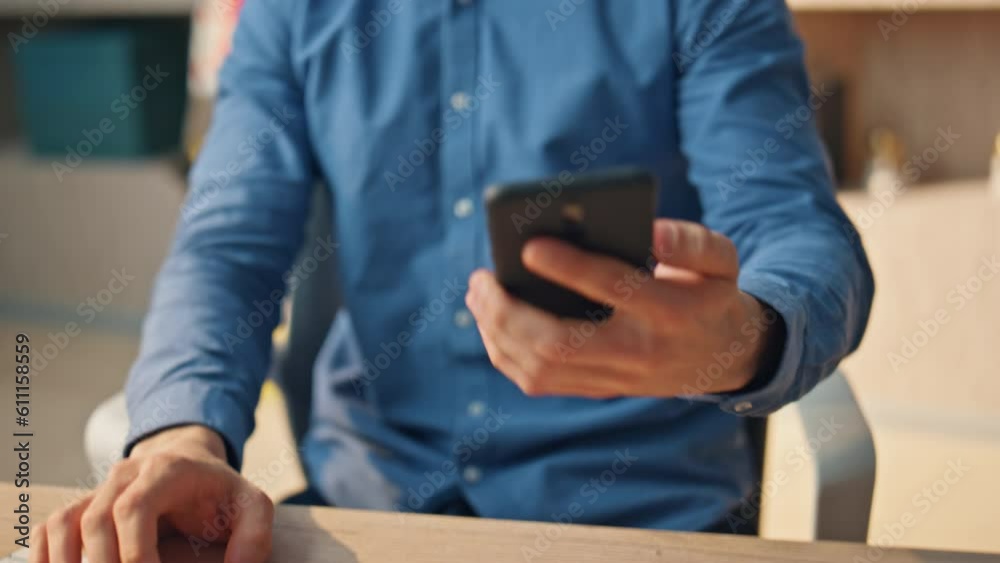 Man hand answering call at office closeup. Business guy picking up smartphone Man hand answering call at office closeup. Business guy picking up smartphone