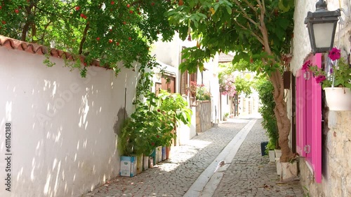 Footage of narrow street, traditional, old historical houses in famous, touristic Aegean town called 