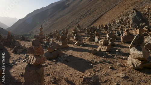 view of the Elqui Valley from a viewpoint in Cochiguaz between stone piles or cairn photo
