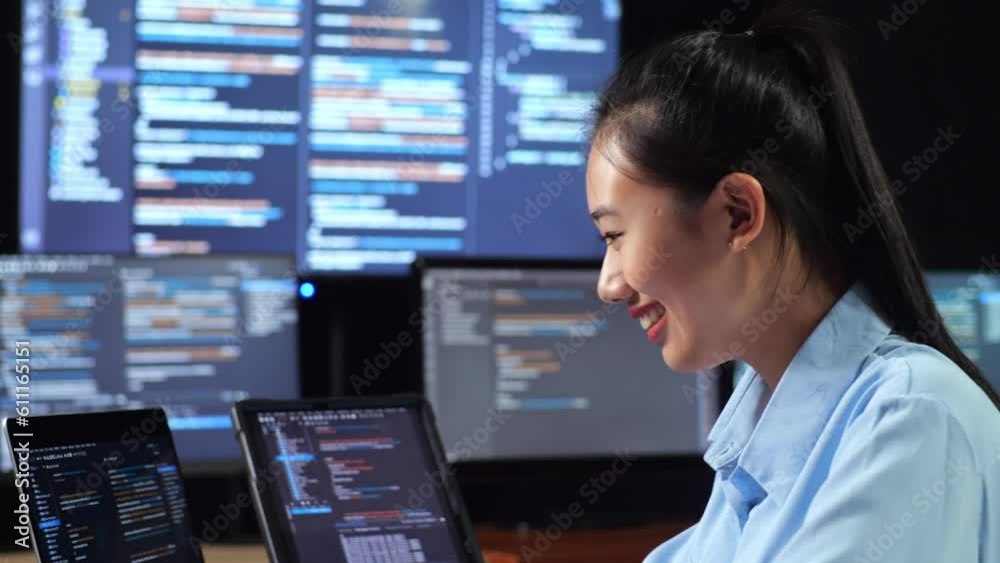 Close Up Side View Of Asian Female Programmer Looking At Database On Tablet And Writing Code By A Laptop Using Multiple Monitors Showing Database On Desktops In The Office
Close Up Side View Of Asian Female Programmer Looking At Database On Tablet And Writing Code By A Laptop Using Multiple Monitors Showing Database On Desktops In The Office